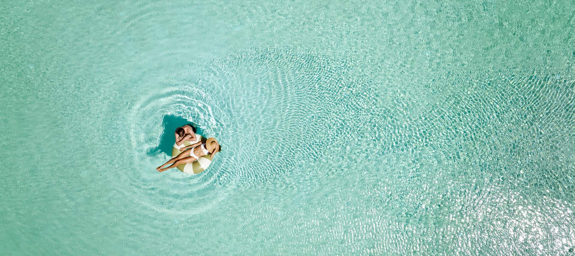 er_rho_elissa_lifestyle_aerial_main_pool_couple_01-2-2.jpg